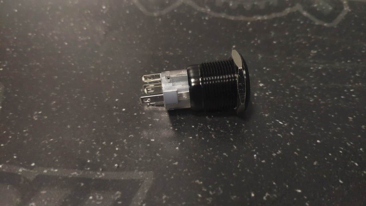 Кнопка черная без фиксации водонепроницаемая 12В 3А - белая подсветка